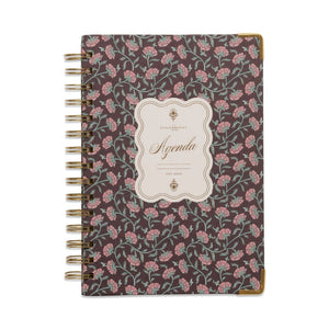 Floral patterned notebook with 'Agenda' label on a white background