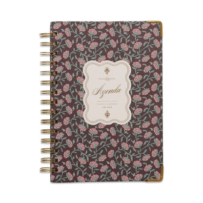 Floral patterned notebook with 'Agenda' label on a white background