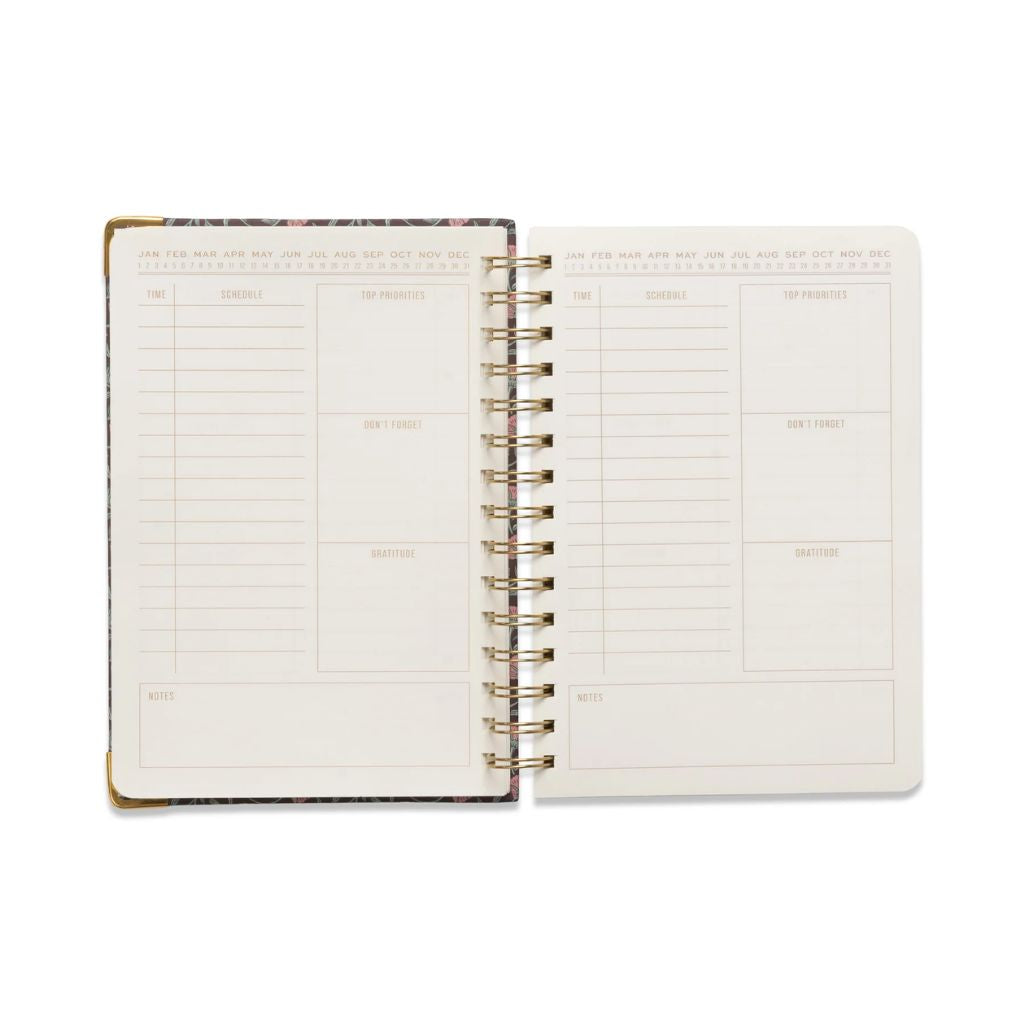 Open planner with weekly/monthly layout on a white background