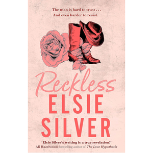 Book cover of 'Reckless' by Elsie Silver with cowboy boots and rose on a pink background
