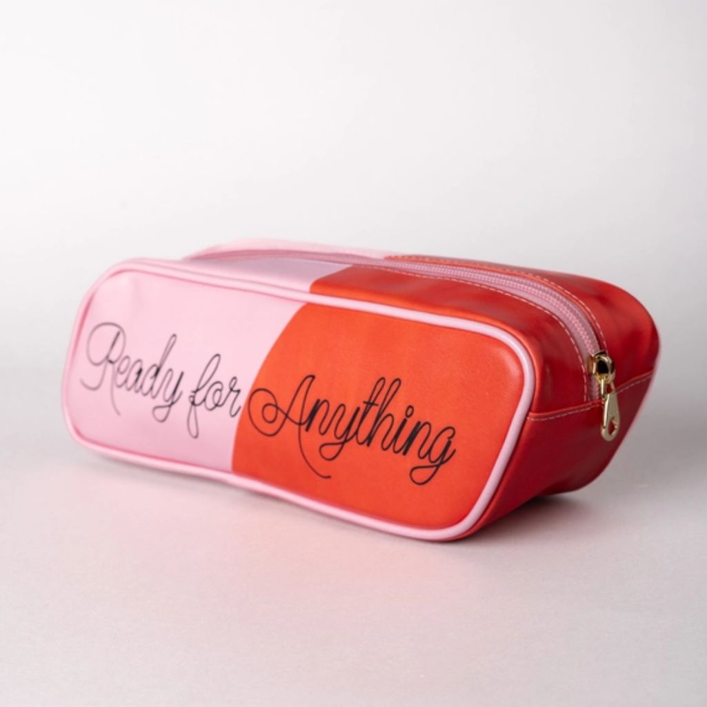 Pink and red pouch with 'Ready for Anything' text on a light gray background