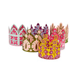 Set of colorful paper crowns with floral patterns on a white background
