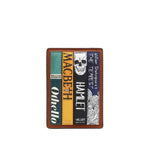 A brown leather bifold wallet featuring printed illustrations of four classic literature book covers: 'Othello', 'Macbeth', 'Hamlet', and 'The Tempest', with William Shakespeare text and a skull graphic.