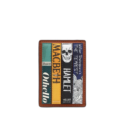 A brown leather bifold wallet featuring printed illustrations of four classic literature book covers: 'Othello', 'Macbeth', 'Hamlet', and 'The Tempest', with William Shakespeare text and a skull graphic.