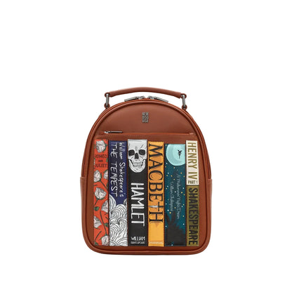 A brown leather backpack with a book spine design featuring Shakespeare's most famous plays.
