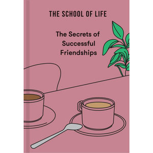 Book cover of 'The Secrets of Successful Friendships' by The School of Life with two cups on a table.