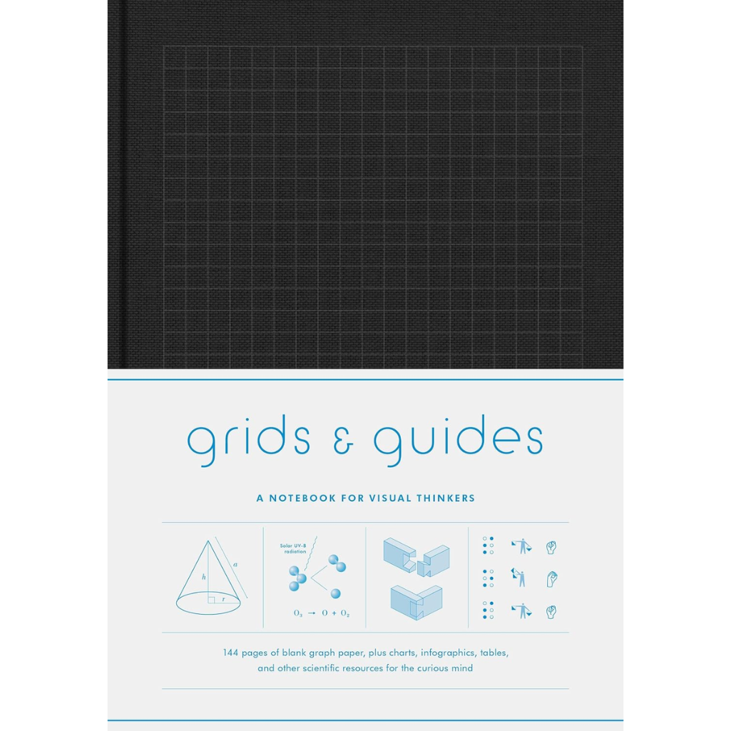 Notebook with grid pattern on cover and text 'grids & guides' on white background
