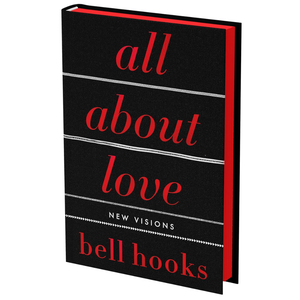 Book titled 'all about love: New Visions' by bell hooks with black cover and red text.