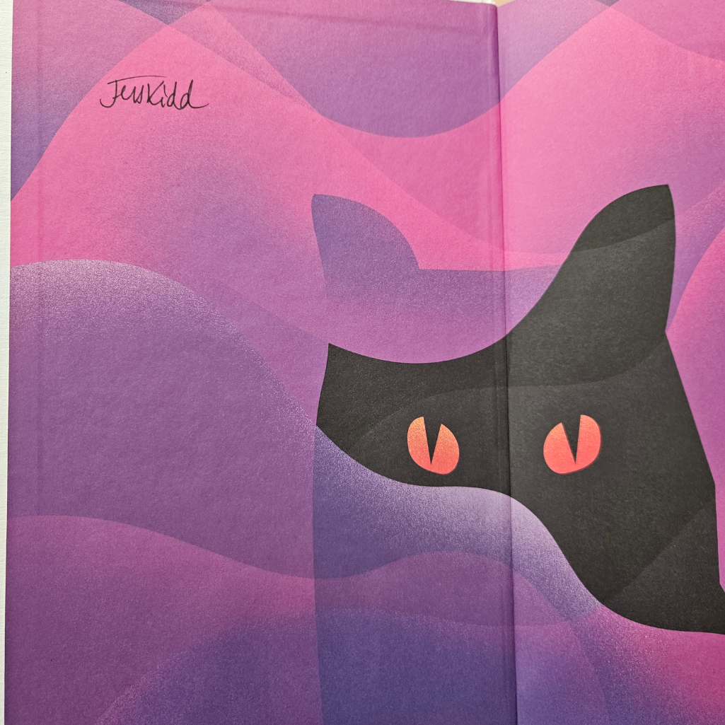 A close-up of a book or printed cover featuring a stylized black cat face with pink eyes against wavy pink and purple abstract shapes. The word 'Jenkid' appears in script near the upper left.