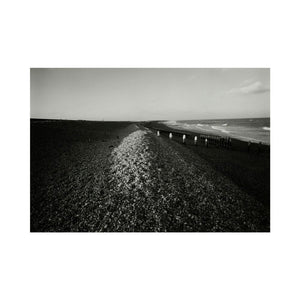 People on shingle beach