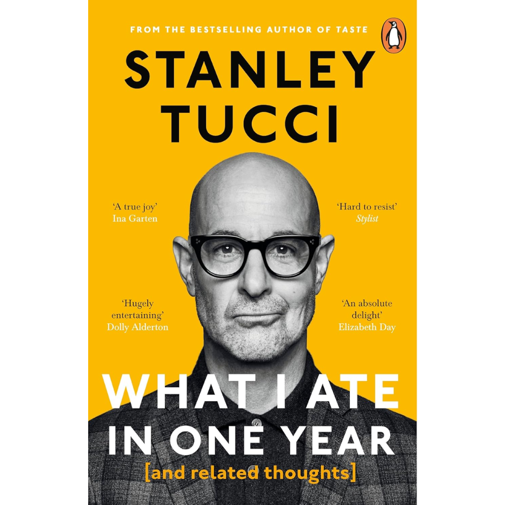 Book cover of 'What I Ate in One Year' by Stanley Tucci with a yellow background and black text.