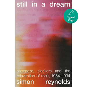 Book cover of 'still in a dream' by Simon Reynolds with a colorful blurred background and a green signed copy badge.