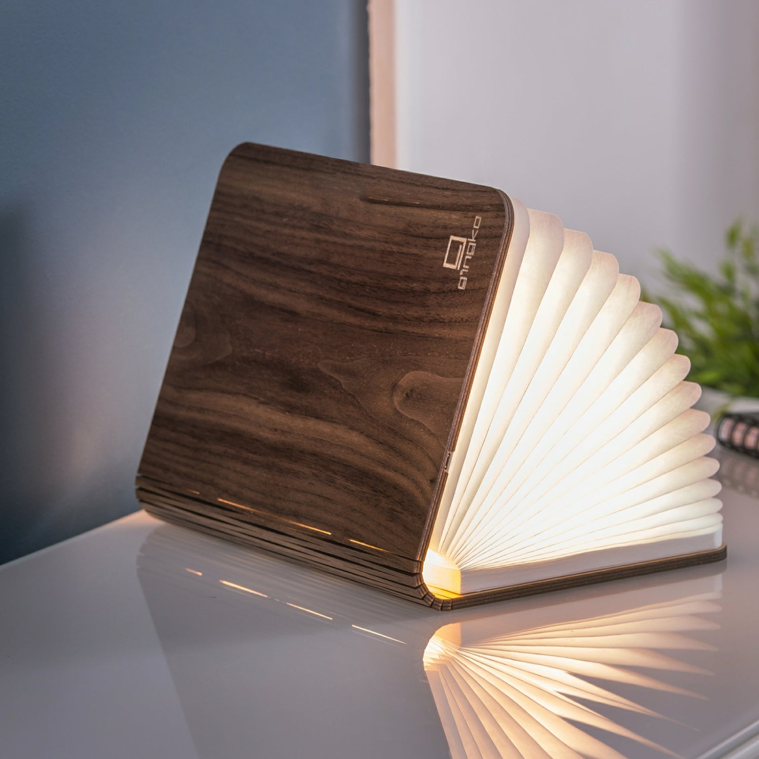 Smart Book Light Walnut Mini partially open on side lifestyle shot