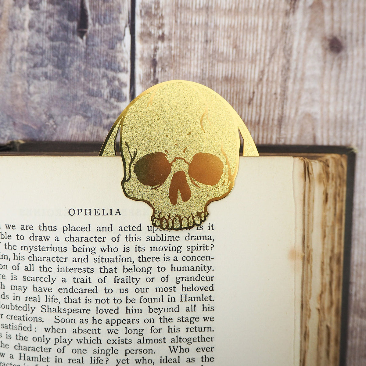 image of Hamlet Skull Bookmark tucked onto a page